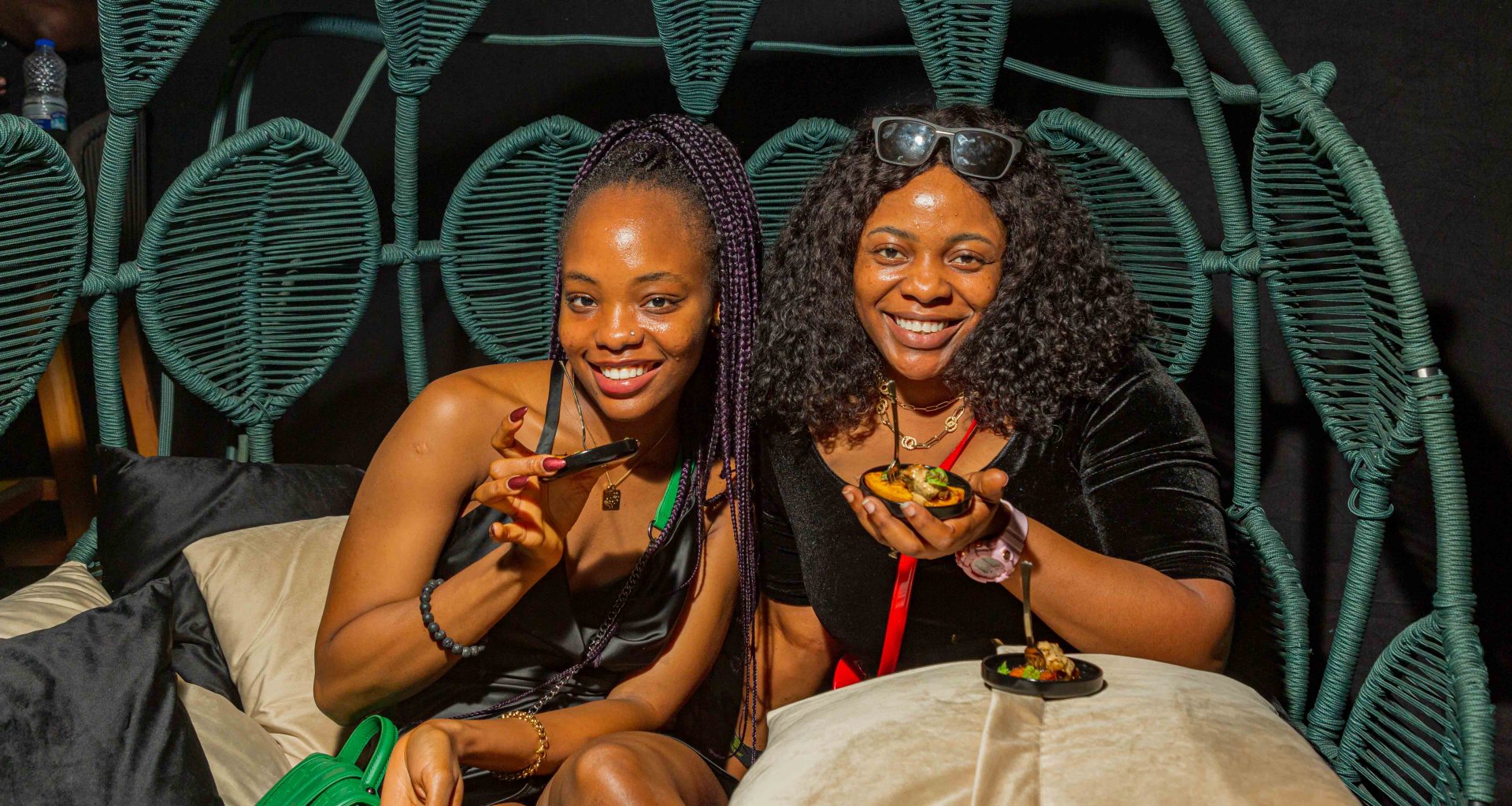 two ladies at a table smiling