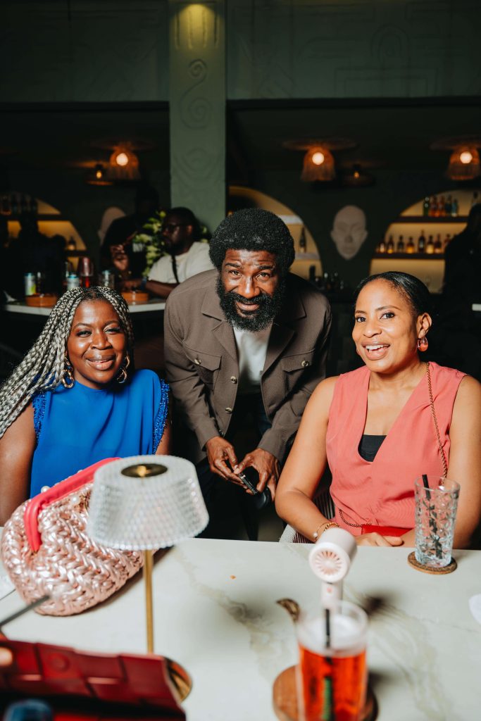 man and two woman at a table